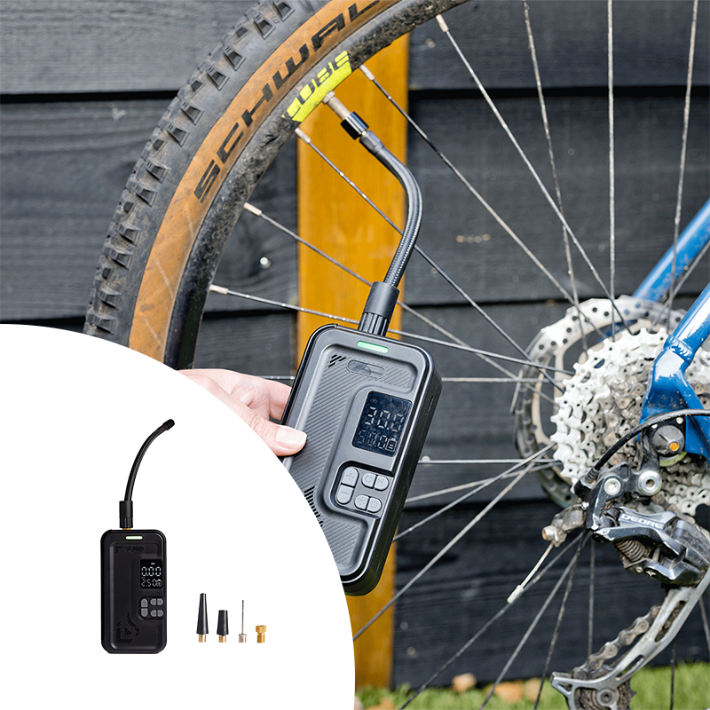 QLT Luchtcompressor met Opbergvak terwijl deze een fietsband op aan het pompen is. QLT Luchtcompressor met Opbergvak terwijl deze een fietsband op aan het pompen is.